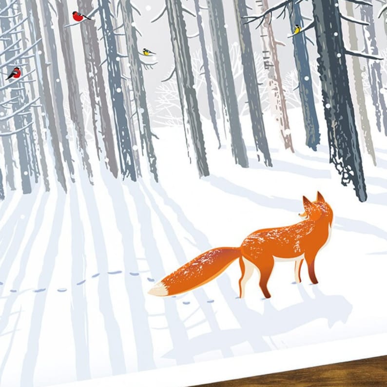 A close up of the fox staring into the snowy trees on the front of the Christmas card.