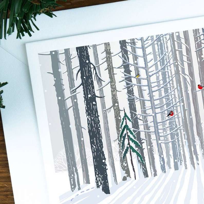 A close up of the snowy trees on the front of the Christmas card.