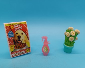 Barbie doll accessories, dog food bag, potted daisies, spray bottle. 90s
