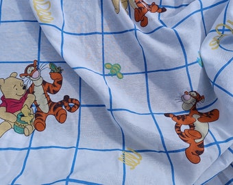 Winnie the Pooh and Tigger on blue graph, with bees and springs, fitted twin bed sheet disney, fabric, sew, sewing, bed, bedding