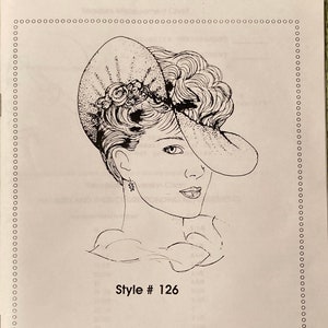 May include: A black and white line drawing of a woman wearing a hat with a floral design. The text "Style # 126" and "D.L. Designs" are below the image. © Copyright 1987 D.L. Designs