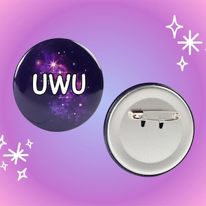 May include: A round button with a galaxy print and the text "UWU" in white. The back of the button is silver with a safety pin.