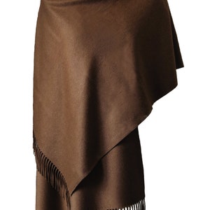 May include: A brown wool shawl with fringe on the edges.