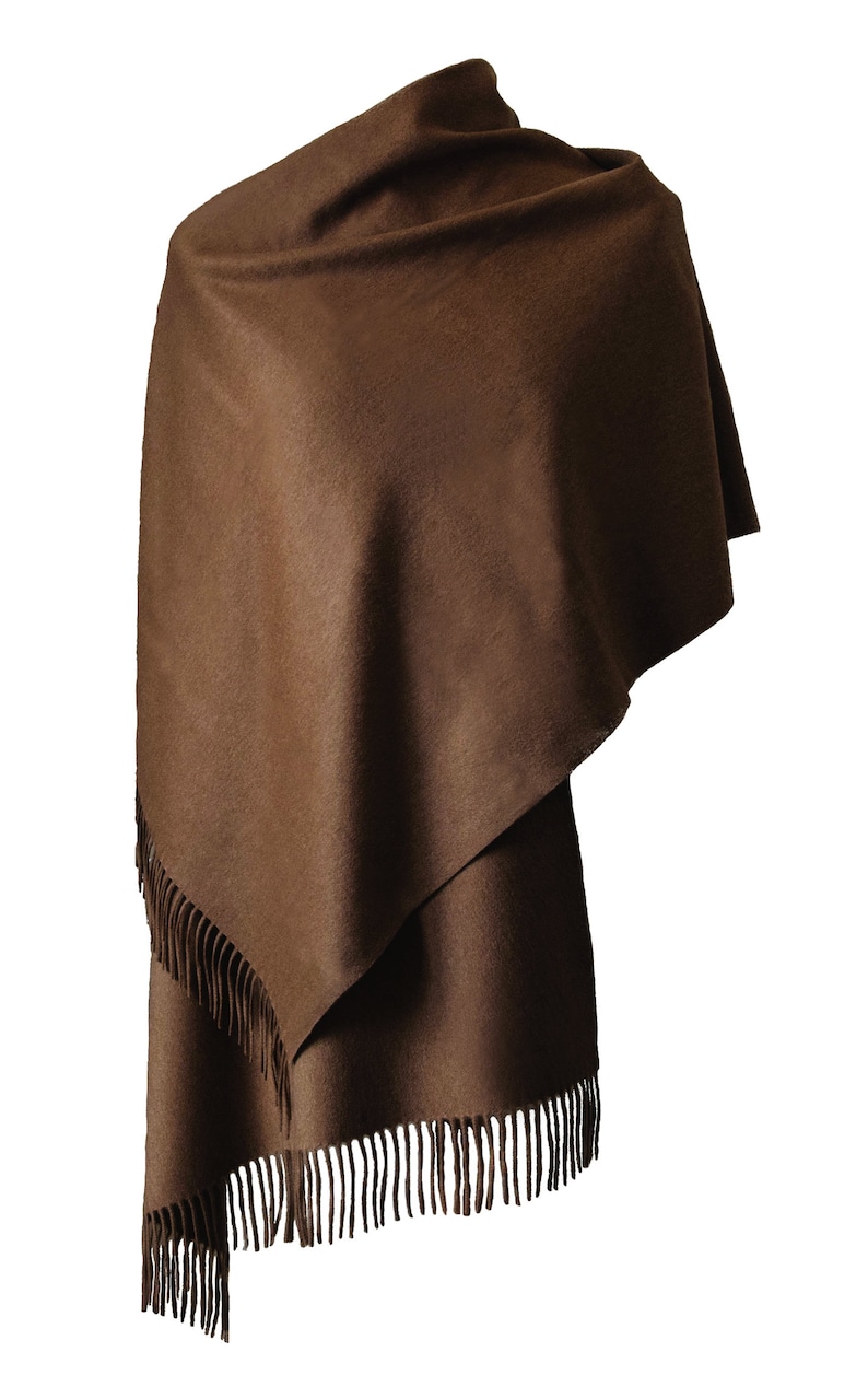 May include: A brown wool shawl with fringe on the edges.