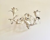 Pair of antique ornate sconces with antique patina Wall candle holders of lilies and flowers French ornate candlestick