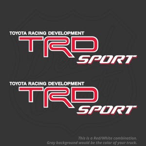 May include: Two red and white TRD Sport decals. The text "TOYOTA RACING DEVELOPMENT" is above the TRD logo. The text "SPORT" is below the logo. The gray background would be the colour of your truck.