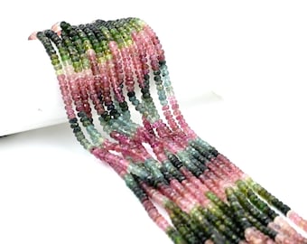 May include: A strand of multi-colored gemstone beads. The beads are round and have a faceted finish. The colors of the beads are pink, green, and blue. The beads are strung on a clear thread.