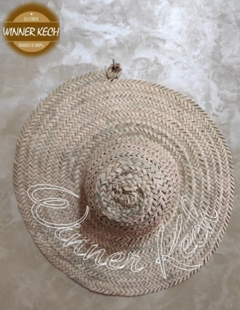 May include: A large, round, woven straw hat with a wide brim. The hat is made of natural straw and has a simple, classic design.
