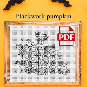May include: Black and white cross-stitch pattern of a pumpkin with leaves in a wooden frame. The pattern is labelled "Blackwork pumpkin" and "PDF".