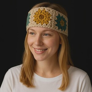 May include: A crocheted headband featuring a floral design. The headband is made of beige yarn with three square floral motifs in yellow and teal. The woman in the image is wearing a white t-shirt.