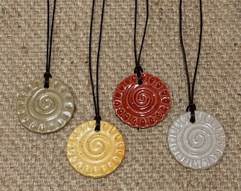 Pendant necklace, ceramic spiral with leather cord. Pottery jewelry