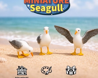 May include: Three miniature seagull figurines with white bodies, grey wings, and yellow feet and beaks. One bird is looking down, one stands upright, and one has wings spread wide. The text reads MINIATURE Seagull, DOLLHOUSE & DIORAMAS, HAND PAINTED, CUTE & UNIQUE.