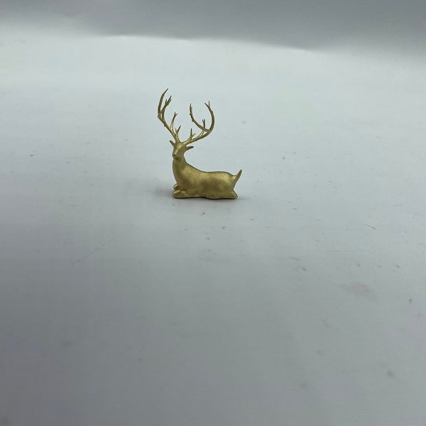 Tiny reindeer laying down