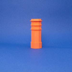 May include: A terracotta-colored chimney pot with a decorative design. The chimney pot is made of a smooth, textured material.