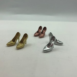 Tiny pairs of stiletto heeled shoes, miniature dollhouse footwear,  elegant decor for dollhouses. Prop