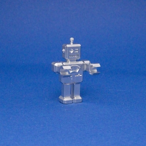 Miniature sci-fi toy robot, tiny collectible robot figurine, futuristic dollhouse accessory, detailed sci-fi decor, robot gift.