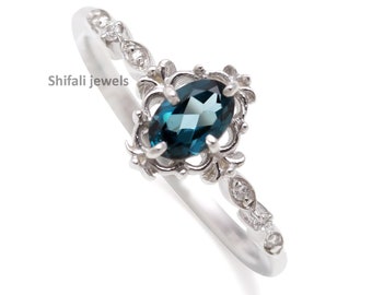 Art Deco London Blue Topaz Ring: Oval Cut Sterling Silver Halo Ring