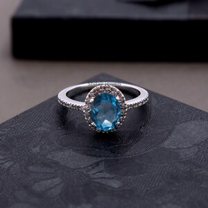 Swiss Blue Topaz Ring: Sterling Silver, Cubic Zirconia Halo