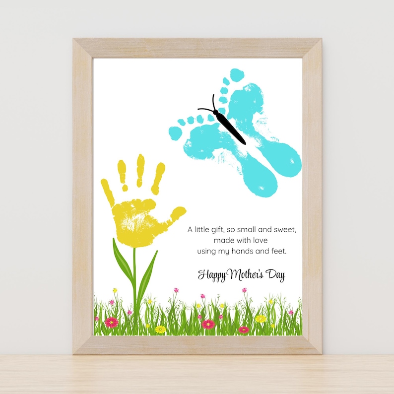 May include: A handprint art print with a yellow handprint flower and a blue footprint butterfly. The print has the text "A little gift, so small and sweet, made with love using my hands and feet. Happy Mother's Day".