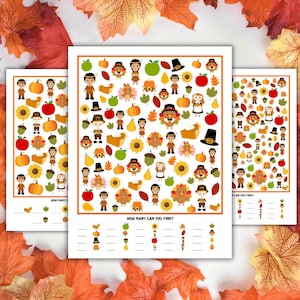 May include: Three activity sheets with a white border, featuring a "How Many Can You Find?" game, themed around Thanksgiving. The sheets are filled with cartoon illustrations of turkeys, pilgrims, pumpkins, and other autumn elements. The background includes autumn leaves.
