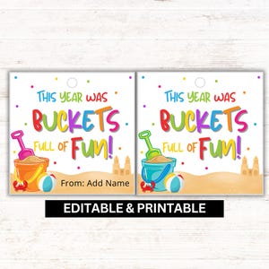 May include: Two square printable tags with a beach theme. The tags read "THIS YEAR WAS BUCKETS FULL OF FUN!" in colorful text. Each tag features a sand bucket, shovel, beach ball, and crab illustration.