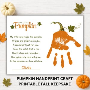 May include: A white rectangular print featuring the orange text My Little Pumpkin and a poem about a handprint. An orange handprint shaped like a pumpkin with a green stem and leaf is on the right. The name Olivia is printed at the bottom.