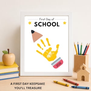 Framed First Day of School handprint keepsake printable displayed as a school memory.