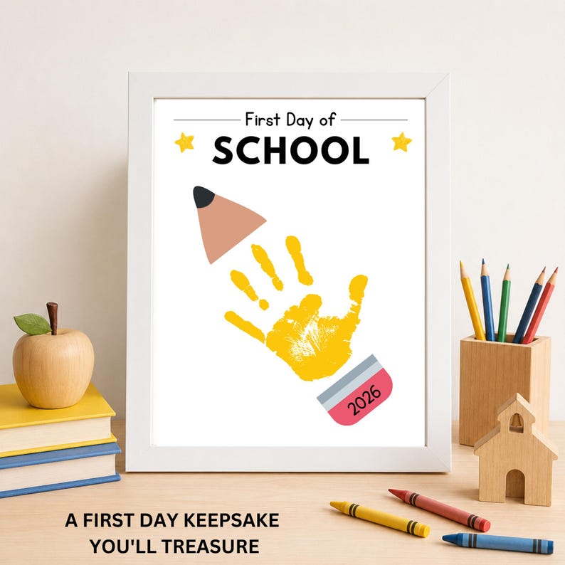 Framed First Day of School handprint keepsake printable displayed as a school memory.