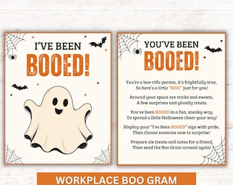 May include: Two rectangular signs with white backgrounds and orange text. The left sign reads I'VE BEEN BOOED! with a central ghost illustration. The right sign contains a poem about being booed, surrounded by black spiderwebs, bats, and spiders.