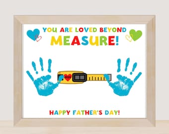 May include: A framed print with the text "YOU ARE LOVED BEYOND MEASURE!" in colorful letters. The image includes blue handprints, hearts, and a yellow tape measure. The words "HAPPY FATHER'S DAY!" are at the bottom.