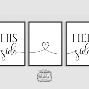 May include: Three black framed prints with white backgrounds. The left print says "HIS side" in black cursive text. The right print says "HER side" in black cursive text. The middle print has a simple black line drawing of a heart.