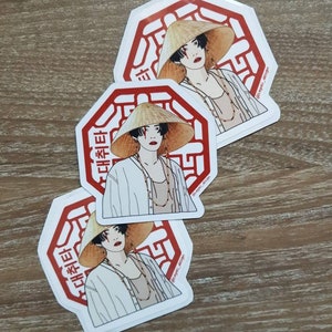 May include: Three white octagonal stickers with red borders and a stylized illustration of a person wearing a conical hat and a white shirt. The text "대답타" is written in Korean on the stickers.