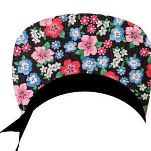 May include: A floral patterned scrub cap featuring a black base with a colorful array of pink, red, blue, and white flowers. The cap has a black band and ties.