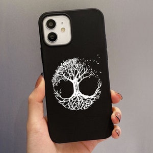 May include: Black phone case with a white tree of life design. The tree is circular, with detailed branches and roots. The case has a matte finish and is shown on a grey background.