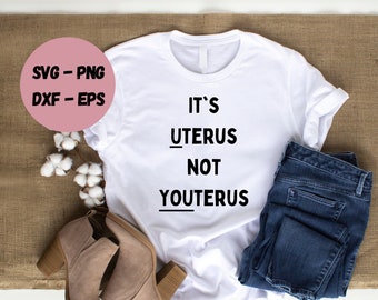 May include: White t-shirt with the text "It's Uterus Not Youtterus" printed on it. The shirt is laid out on a brown burlap surface with a pair of brown ankle boots and blue jeans.