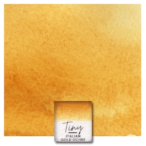 May include: A square of watercolor paper with a golden ochre wash. A small, rectangular watercolor paint block is in the lower center, with the text "Tiny ITALIAN GOLD OCHRE" on the label.