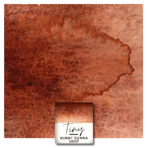 Op de afbeelding: Een aquarelwasmonster van Burnt Sienna Deep verf in een Tiny formaat. De kleur is een diep, rijk bruin met een licht roodachtige tint.