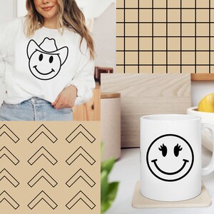 May include: A white sweatshirt featuring a black smiley face wearing a cowboy hat. The background is a brown and black geometric pattern.
