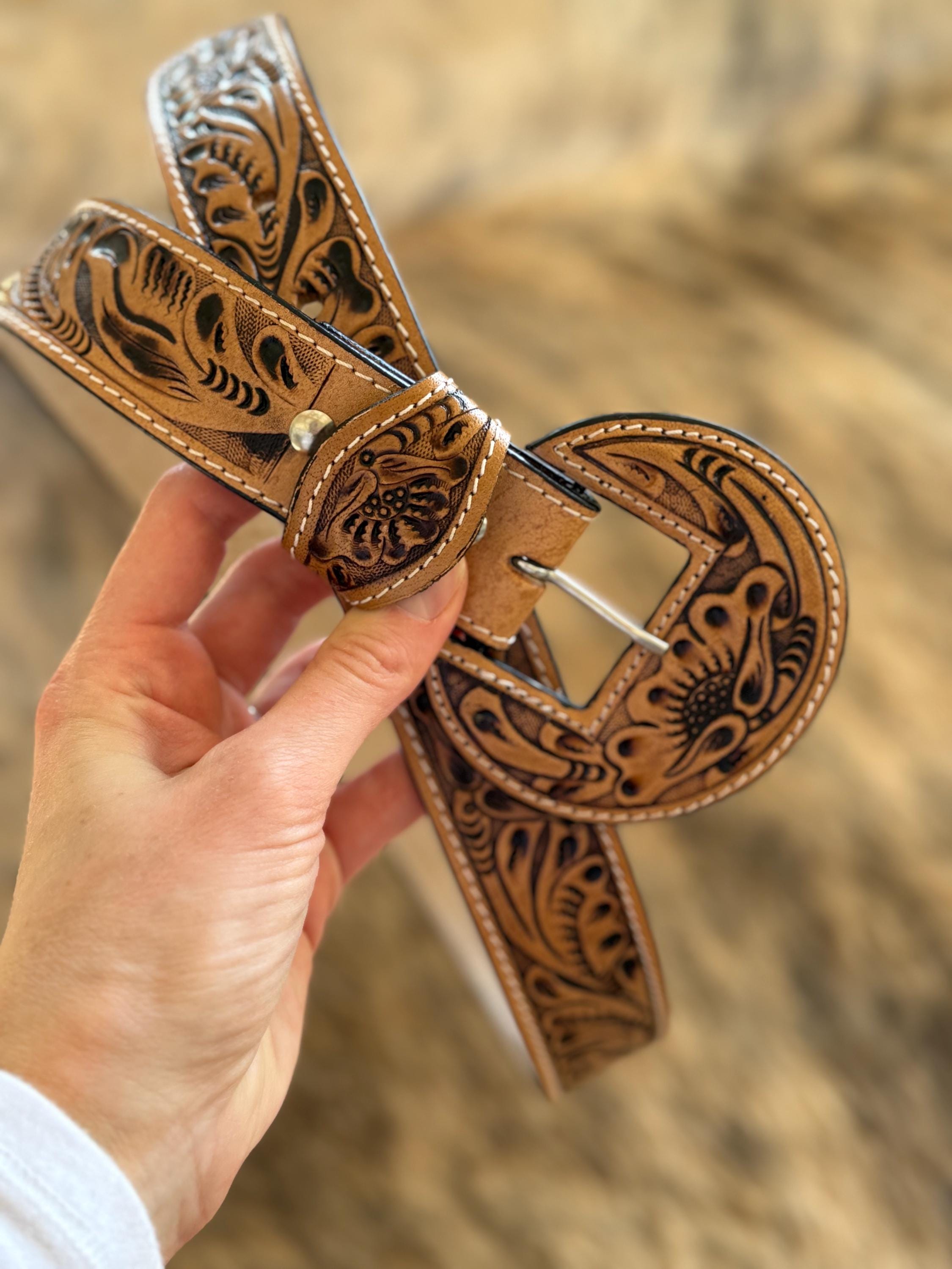 Round buckle tooled leather belt