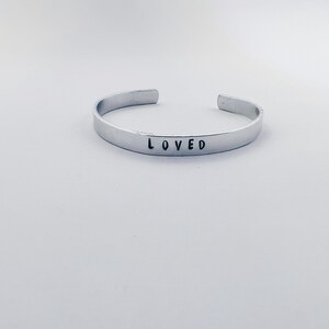 Hand Stamped Metal Adjustable “Loved” Cuff Bracelet