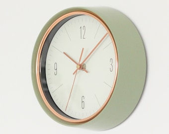 Sage Green Mid-Century Modern Wall Clock with Copper Accents and White Background