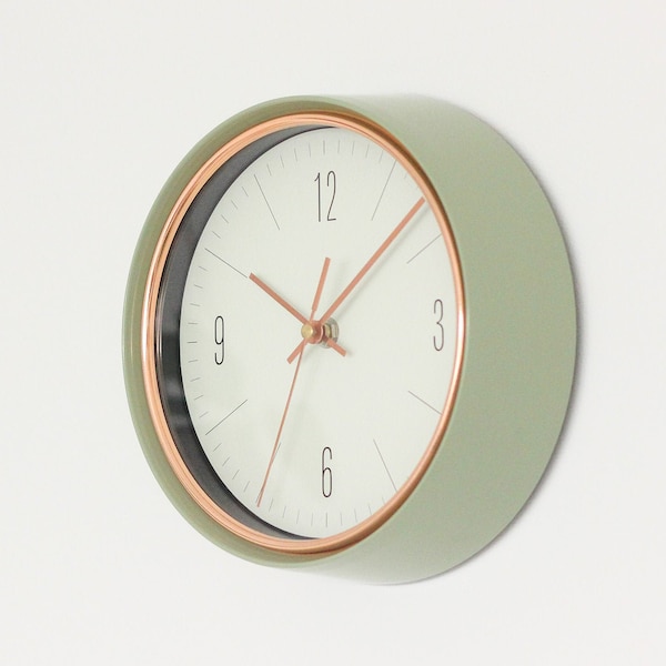 Sage Green Mid-Century Modern Wall Clock with Copper Accents and White Background