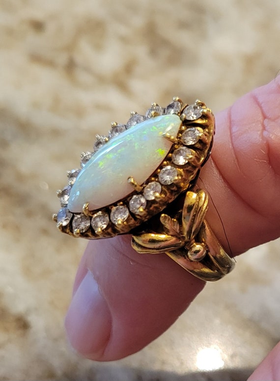 14k gold LA Triomphe opal and diamond ring..approx