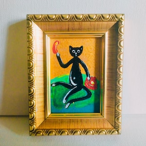 Un chat noir est assis sur un canapé vert et parle au téléphone peinture acrylique originale chat drôle oeuvre murale peinture dorée Illustration mignon