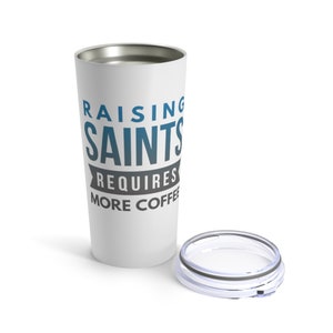 May include: White stainless steel travel mug with a blue and grey design that says "Raising Saints Requires More Coffee".