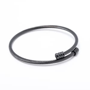 May include: A black metal cable bracelet with a twisted design and a clasp closure.
