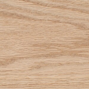 May include: Close-up of a light brown wood grain texture. The wood has a natural, warm tone and a smooth surface.