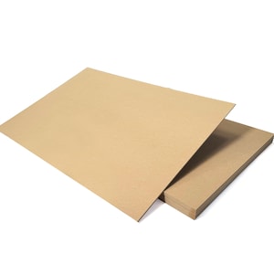 May include: A stack of brown cardboard sheets. The sheets are thick and sturdy, and they are perfect for crafting or other projects.