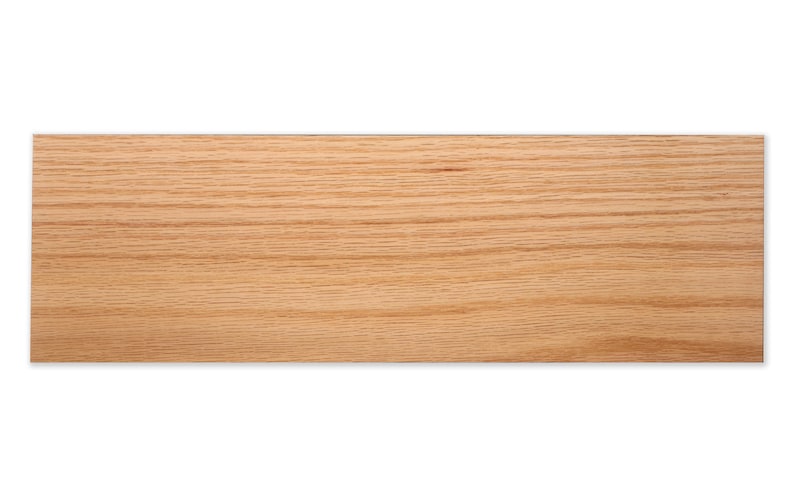May include: A close-up of a light brown wood grain surface. The wood has a natural, unfinished look.