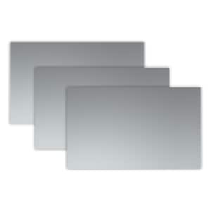 May include: Three rectangular pieces of gray metal, stacked on top of each other, with the largest piece at the bottom and the smallest piece at the top.